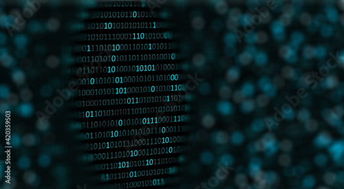 Blurred digital background with selective focus in binary codes lines or zero one digits. Programming and technology revolution digital computer background 