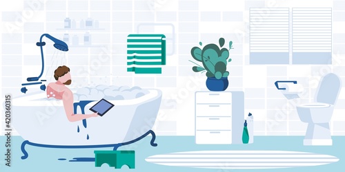 Young man taking bubble bath using laptop