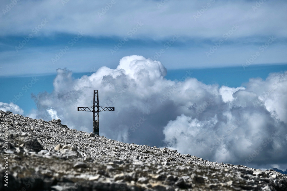 Cross on high mountain pass in Dolomites. Passo Pordoi. Italy. Cross on high mountain pass in Dolomites. Passo Pordoi. Italy.