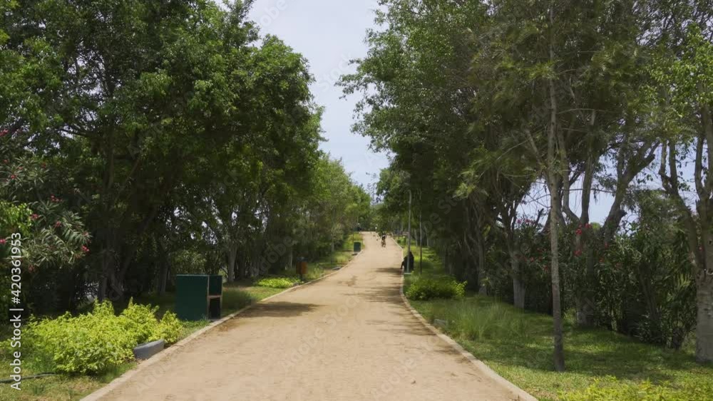 first person view walking up a hill with an urbanized dirt path surrounded by trees and vegetation in the daytime in 4k first person view walking up a hill with an urbanized dirt path surrounded by trees and vegetation in the daytime in 4k