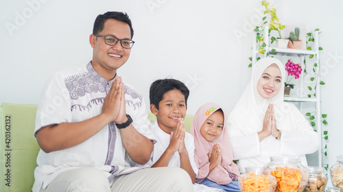 Asian Muslim families celebrate Eid together while enjoying with apology gestures