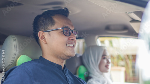 Muslim family in the car will go home to celebrate Eid