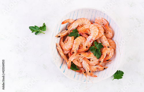 Prawns on bowl. Shrimps, prawns. Whole boiled shrimp. Seafood. Top view, flat lay, copy space