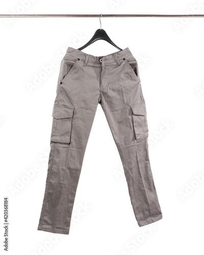 Tableau sur toile Men's cargo pants hanging and isolated on a white background