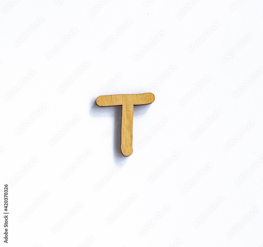wooden letter t isolated on a white background, english alphabet from natural materials for children, eco friendly concept wooden letter t isolated on a white background, english alphabet from natural materials for children, eco friendly concept