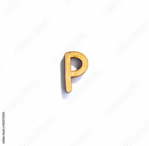 wooden letter p isolated on a white background, english alphabet from natural materials for children, eco friendly concept