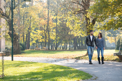 Lovers Walking Hand In Hand In Autumn Park © Jale Ibrak