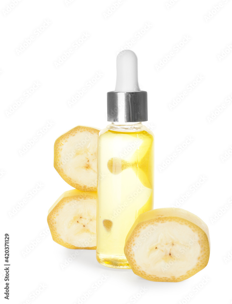 Bottle of banana essential oil on white background Bottle of banana essential oil on white background