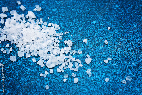 Konstfotografi Coarse salt crystals on a blue table