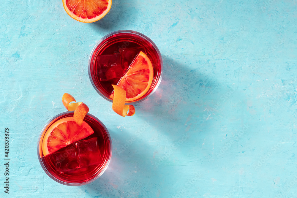 Negroni cocktails decorated with blood oranges, top shot - obrazy, fototapety, plakaty 