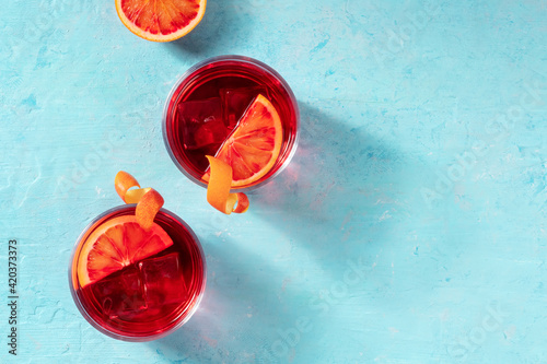 Print op canvas Negroni cocktails decorated with blood oranges, top shot