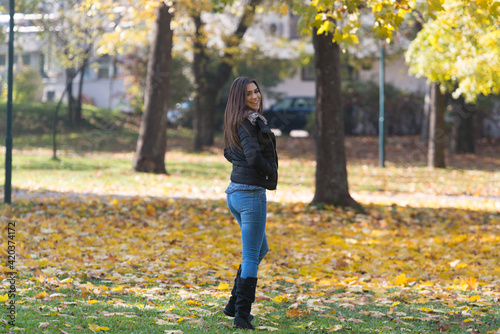Young Woman Walking In Autumn Forest