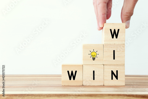 Wooden cubes stack with the text win-win-situation. Strategy and business concept
