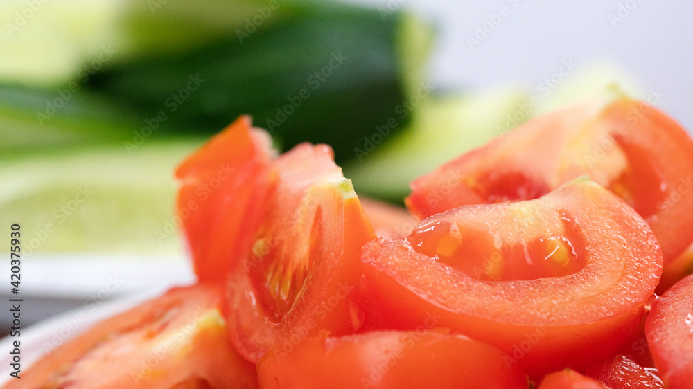 A bunch of fresh chopped tomatoes. close-up. A bunch of fresh chopped tomatoes. close-up.