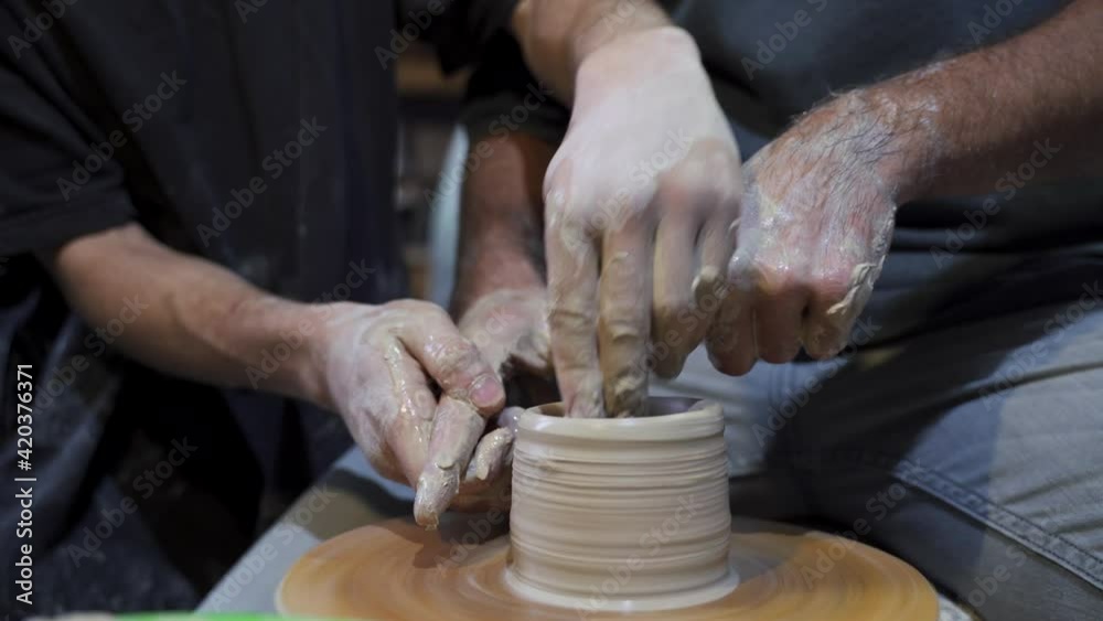 Making a handmade clay pot in the workshop. Pottery lesson with master. Making a handmade clay pot in the workshop. Pottery lesson with master.