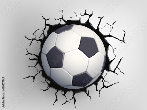Soccer ball flying through the wall with cracks.