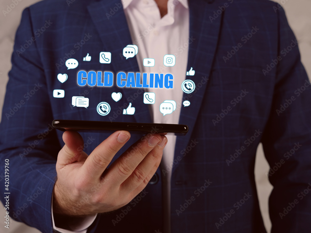 Fototapeta premium COLD CALLING text in search bar. Loan officer looking at cellphone. Cold calling typically refers to solicitation by phone or telemarketing
