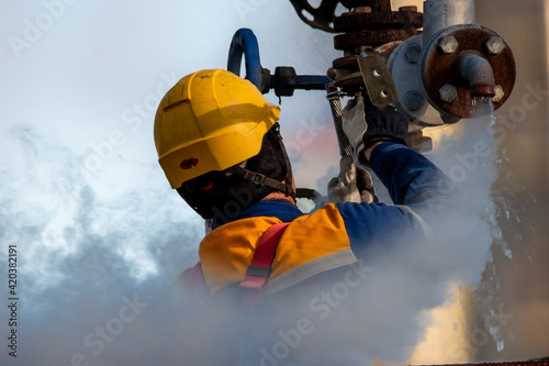 Fitter repairing a damaged, leaking valve © Mike Mareen