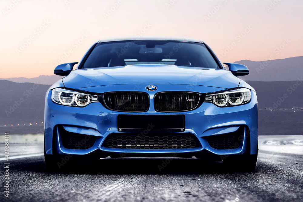 blue BMW m3 on a mountain winding road. front view. Stock Photo