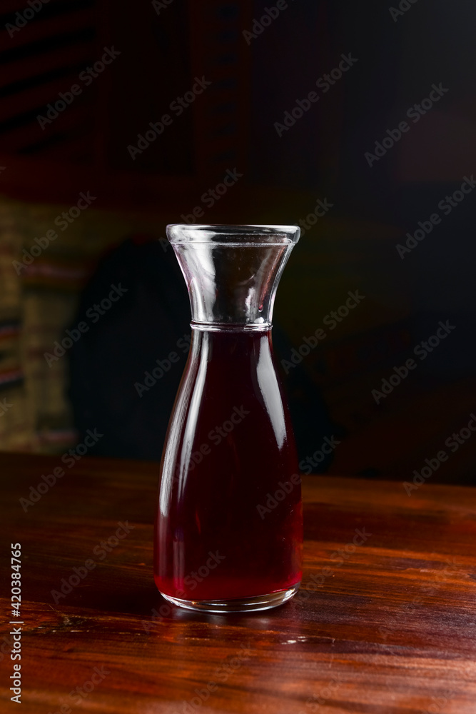 Closeup of mulled wine, in a glass over Traditional Ukrainian tablecloth. Christmas time, winter time. Closeup of mulled wine, in a glass over Traditional Ukrainian tablecloth. Christmas time, winter time.