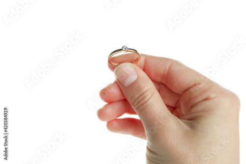 Female hand hold ring, isolated on white background