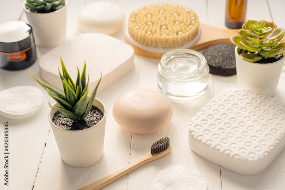 Zen and relax concept. Spa composition with treatment products on light background Zen and relax concept. Spa composition with treatment products on light background