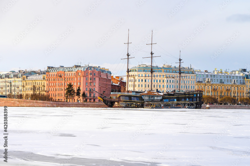 Views of St. Petersburg from the embankment in the city center, the frozen river in early spring