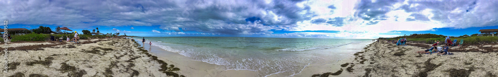KEYS ISLANDS, FL - FEBRUARY 2016: Tourists relax along Sandspur Beach