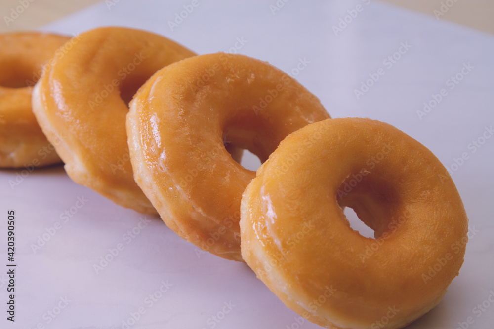 delicious sugary donuts on marbled white background delicious sugary donuts on marbled white background