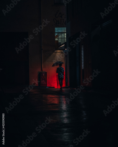 Man alone in a dark alleyway