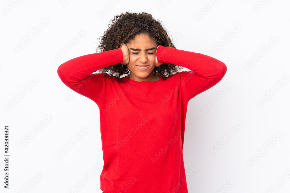 Young African American woman isolated on background frustrated and covering ears