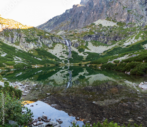 Velicke pleso lake and Velicky vodopad waterfall in Vysoke Tatry mountains in Slovakia