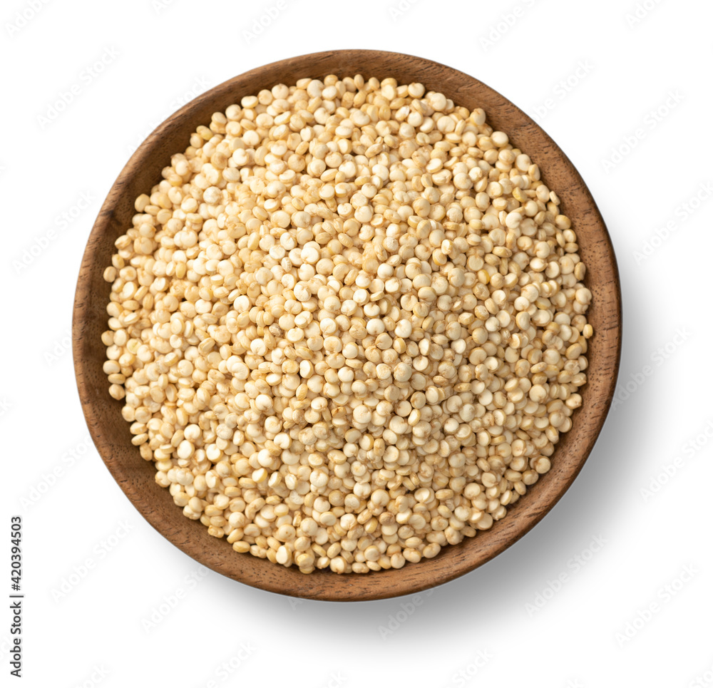 uncooked white quinoa seeds, in the wooden bowl, isolated on pure white background, overhead view. uncooked white quinoa seeds, in the wooden bowl, isolated on pure white background, overhead view.