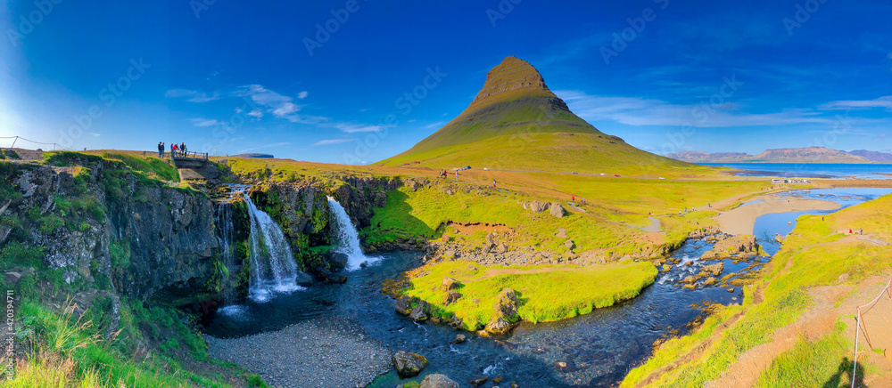 Kirkjufellfoss scenic spot with iconic waterfall and peak in Iceland