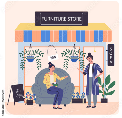 Furniture store, female buyer consults with seller regarding purchase of chair during sale