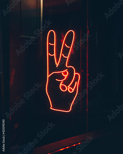 Two finger peace neon sign
