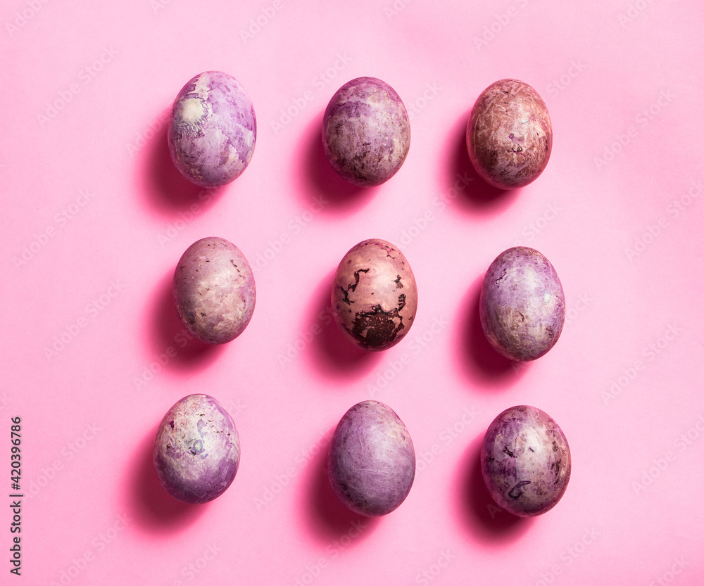 Colorful nine painted eggs on the pink surface. Easter flat lay with copy space. Image for greetings and invitation cards. Colorful nine painted eggs on the pink surface. Easter flat lay with copy space. Image for greetings and invitation cards.