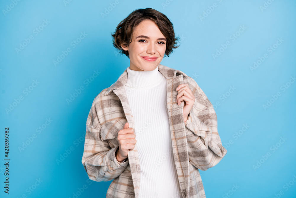 Portrait of optimistic curly short hairdo lady show clothes wear white shirt isolated on vivid teal color background Portrait of optimistic curly short hairdo lady show clothes wear white shirt isolated on vivid teal color background