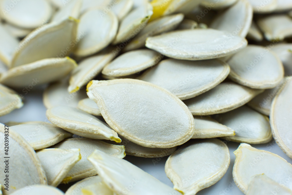 Fresh Pumpkin seeds background. Close up shot. Fresh Pumpkin seeds background. Close up shot.