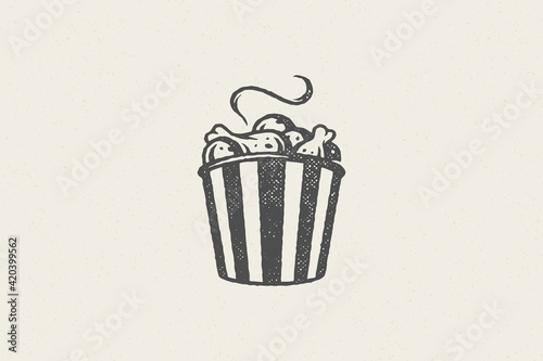 Hot fried chicken drumsticks silhouette in striped bucket hand drawn stamp effect vector illustration.