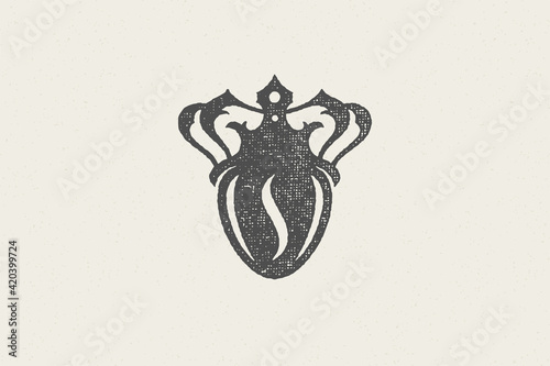 Black silhouette of coffee bean with crown high quality drink hand drawn stamp effect vector illustration.