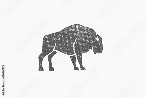 Black silhouette wild buffalo as symbol of wildlife in nature hand drawn stamp effect vector illustration