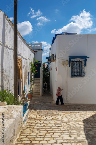 narrow streets of the city in the Andalusian style in white-blue colors