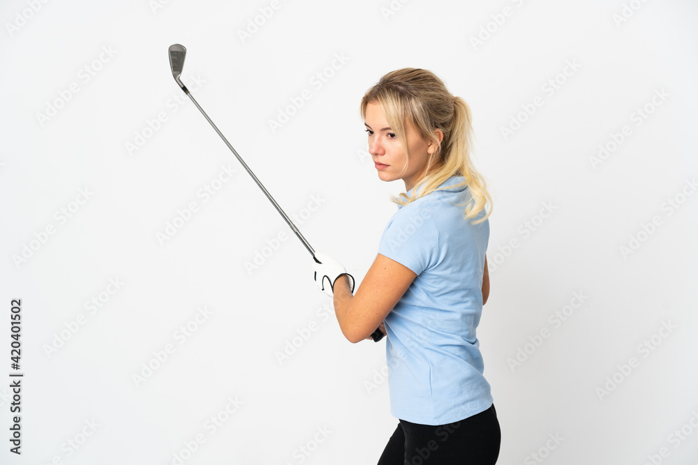 Young Russian woman isolated on white background playing golf Young Russian woman isolated on white background playing golf