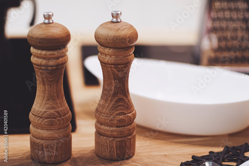 Φωτογραφία Wooden salt and pepper shaker set in the kitchen, eco-friendly product and home