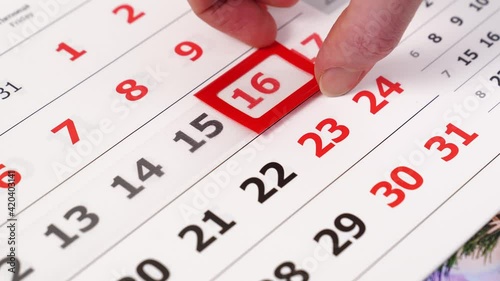 hand shifts the red frame on the calendar from one number to another. 