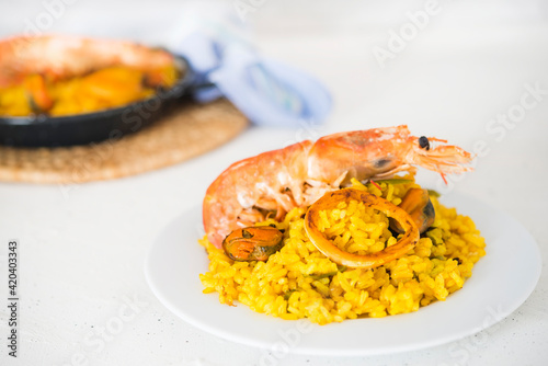 Paella typical spanish food in granite background