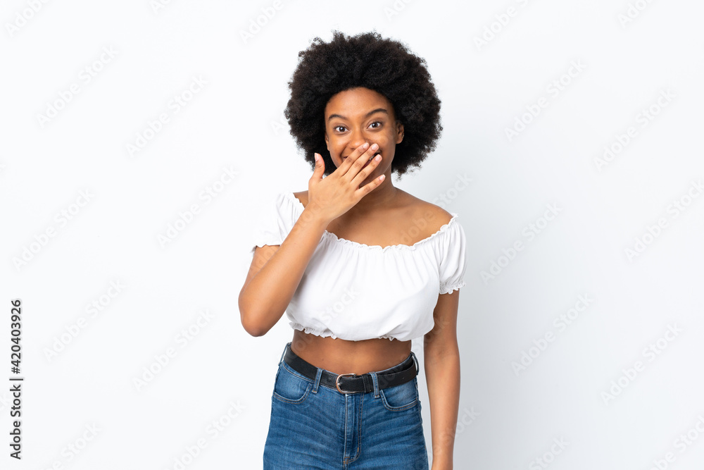 Young African American woman isolated on white background happy and smiling covering mouth with hand Young African American woman isolated on white background happy and smiling covering mouth with hand