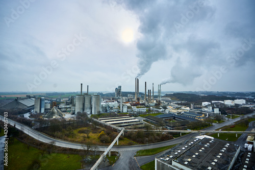 a photography of industrial field with smoke