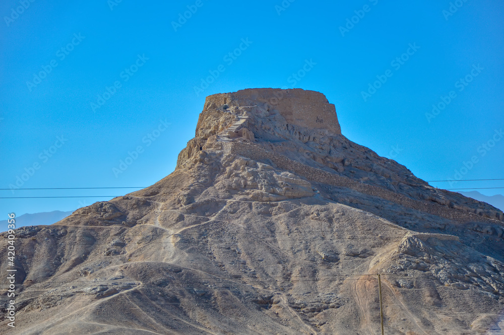 Yazd, Iran - December 5, 2015: Dakhme, or a Tower of Silence, burial site of Zoroastrians of ancient Persia, located outside the city of Yazd in Iran